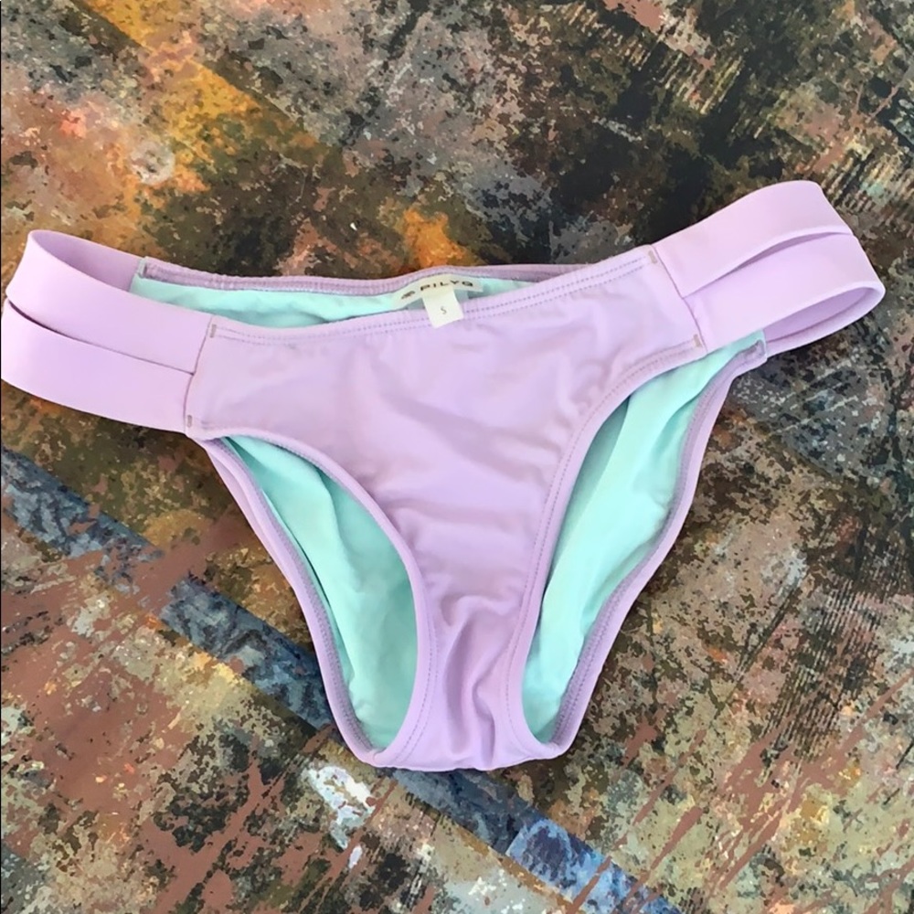 PilyQ purple swim bottoms.